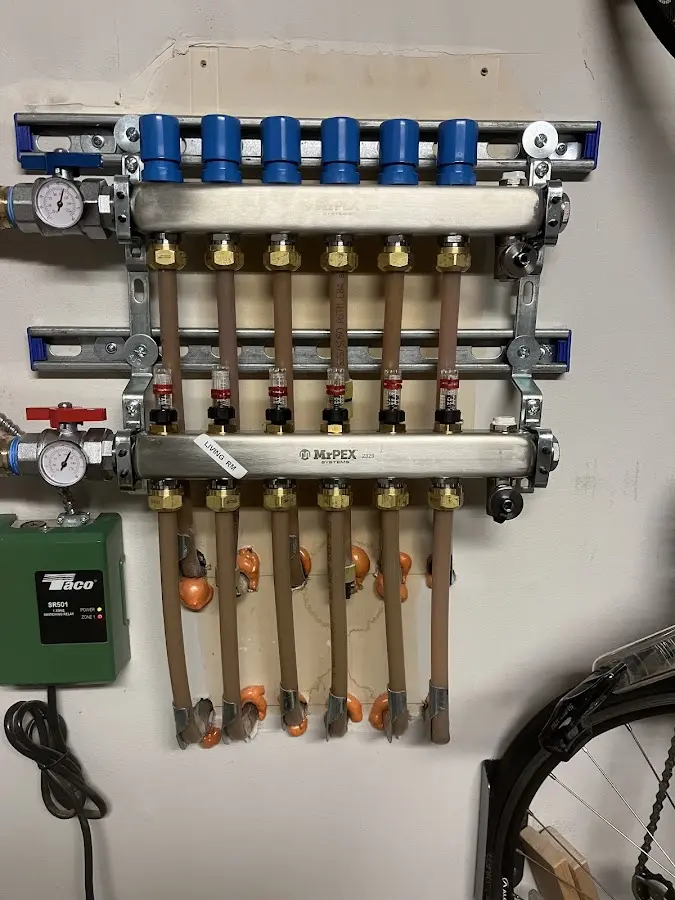 Plumber performing Water Heater Repair at a residential property in Newton